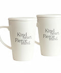 Two white mugs with 'Kind heart. Fierce mind.' text on a white background